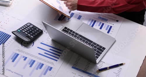 Team of business analysis documents in action office setting report generation professional environment strategic planning