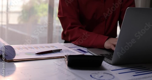 .Business woman working in finance and accounting Analyze financial budget in the office
