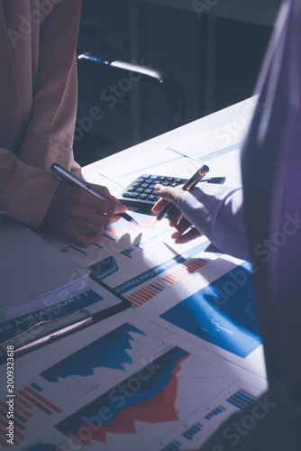 Above table with finance papers, graphs and big data during teamwork meeting with accounting or marketing team discussing budget, strategy or growth development. Closeup of SEO team doing research
