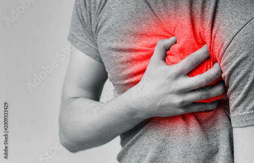 Принти на полотні Acute pain in chest, man touching his inflamed breast, close-up