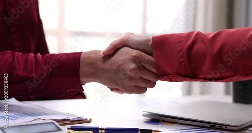 Businesswoman handshake and business people. Successful business concept. Banner background, panoramic view.
