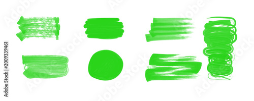 Bright green vector brush strokes and marker stains set. Textured highlights.