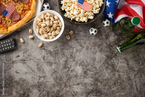 Obraz na plátne Football championship viewing party with USA flag, pizza, popcorn and game day s