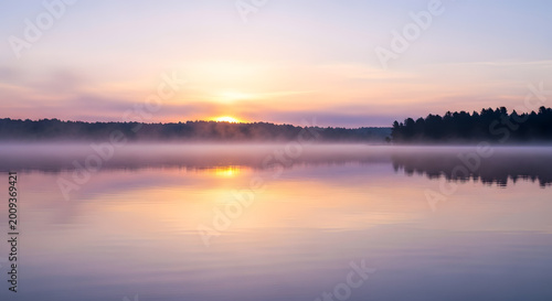 Foto Sunset over calm peaceful lake water 1.