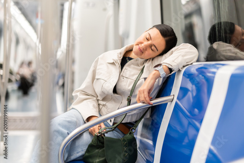 Billede på lærred Woman passenger fell asleep in the subway car