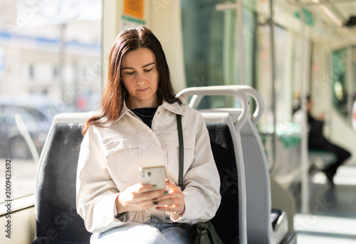 Obraz na płótnie Girl sitting in modern tramway car