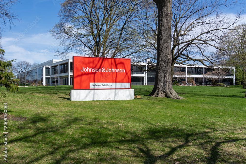 Fototapeta premium Toronto, Ontario, Canada - April 26, 2026: A Johnson and Johnson company ground sign in front of the building on Green Belt Drive in Toronto, Ontario. Johnson and Johnson is an American pharmaceutical