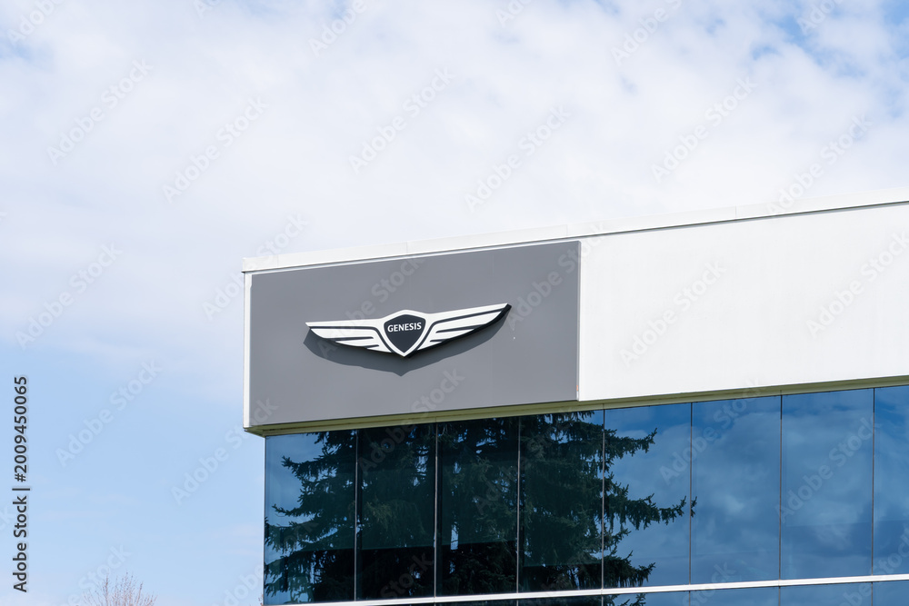 Obraz premium Toronto, Canada - May 3, 2026: A Genesis logo on the building. Toronto, Canada. Genesis is the luxury vehicle brand of the South Korean multinational conglomerate Hyundai Motor Group. 