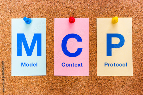 Three colored paper cards pinned to a cork bulletin board display the letters MCP (Model Context Protocol), illustrating the MCP standard for AI integration.