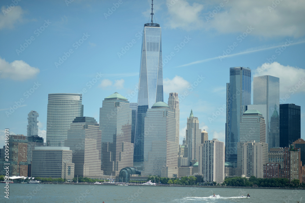 Fototapeta premium Cityscape With Serene Waters. Scenic Urban Landscape Featuring Calm River And Towering Buildings
