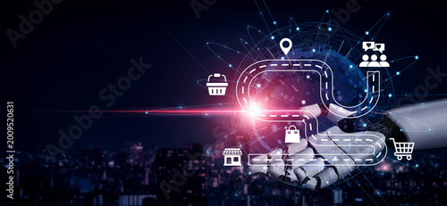 Photos A futuristic robotic hand showcases digital symbols of connectivity and logistics, highlighting advanced transportation solutions within a smart city environment
