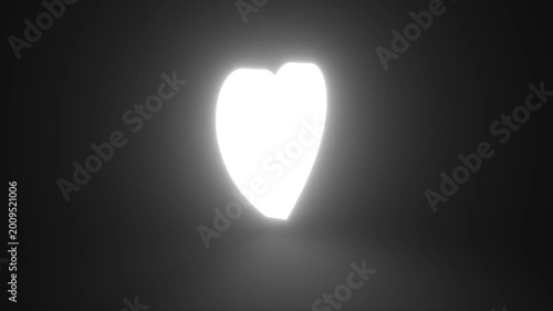 White Heart, Symbol of Love and Valentine's Day Glowing and Rotating on Black Background