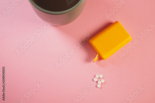 Canvas Print sugar substitute sweeteners next to a cup on a pink surface