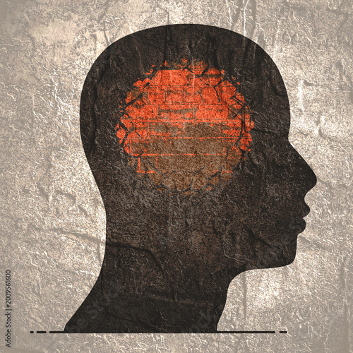 Male head. Psychological and mental health symbol of mental prison and restriction. Fixed mindset. Locked mind. Brick wall inside human head.