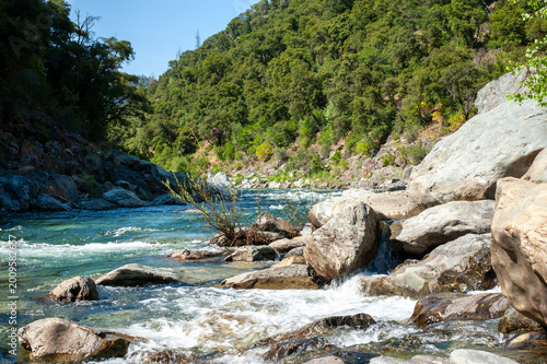 Scenic view of the North Fork American River flowing through a rocky canyon with forested hills, California