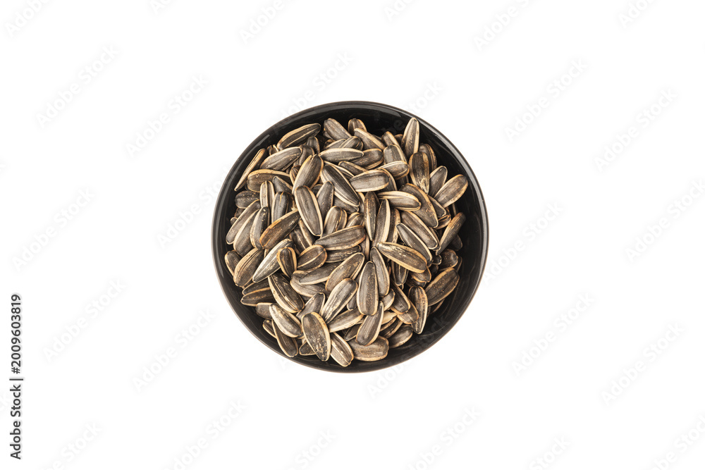 Fototapeta premium Female hand sunflower seeds on a white background isolation