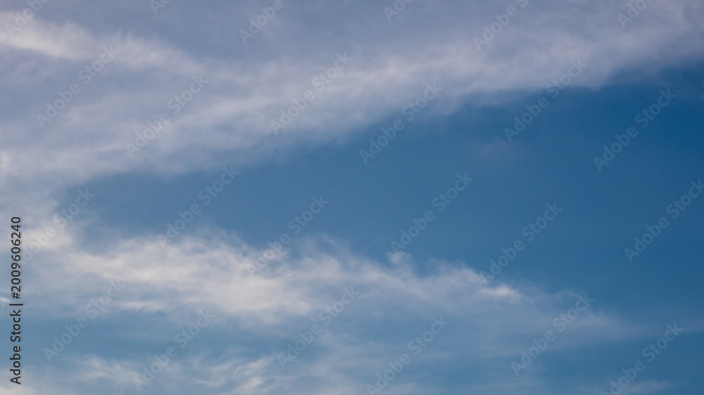 Fototapeta premium Wispy Clouds in Blue Sky