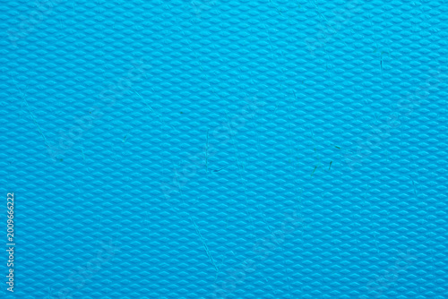 Turquoise blue textured surface with diamond embossed pattern and industrial plastic material