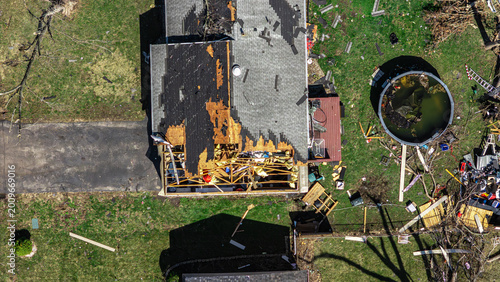 Done of residential neighborhood destruction after a tornado with damaged houses