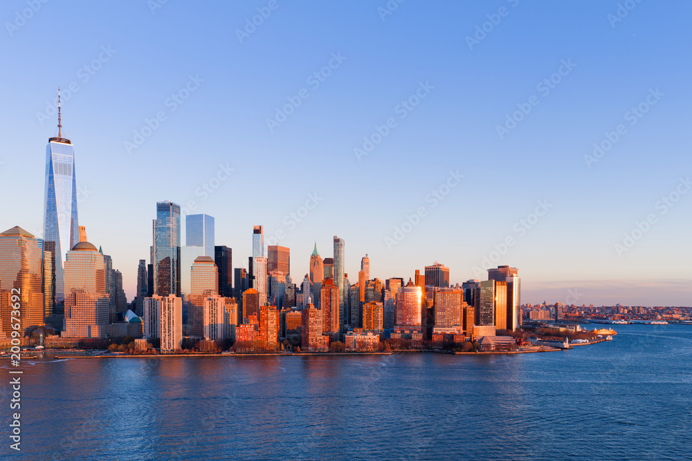 Fototapeta premium New York City at night. NYC skyline night view. New York cityscape waterfront. Manhattan night view. New York panoramic. NYC cityscape. New York night skyline.