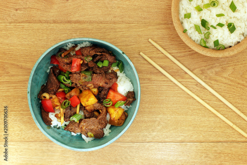 Stir fry pork, sweet peppers, onions ginger and pienapple. Asian cuisine.
