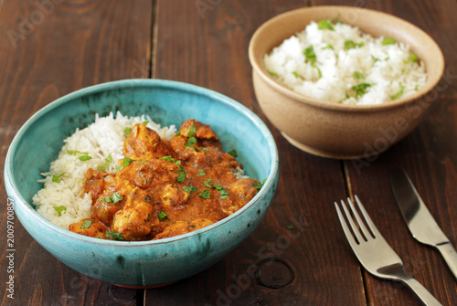 Chicken tikka masala, indian dish, served with rice and spices
