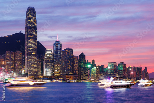 Canvas Print Hong Kong city skyline at sunset with glowing sky and skyscrapers