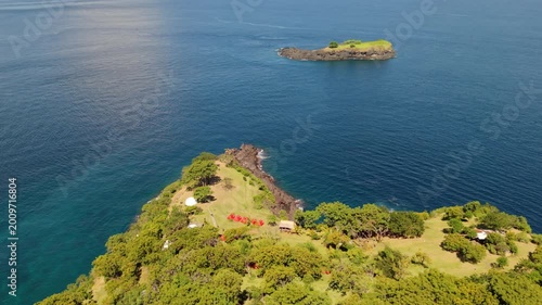 Aerial View of Tropical Glamping Site at Bukit Asah with Scenic Coastline and Islet