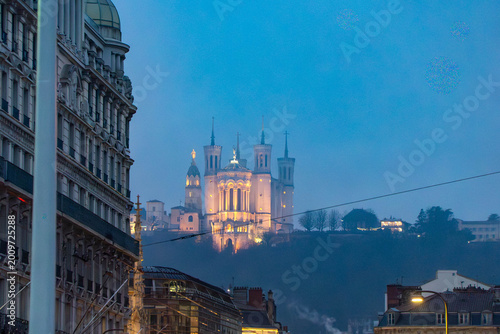 Basilica of Notre-Dame de Fourvière Illuminated at Blue Hour in Lyon, France with Foggy Atmosphere