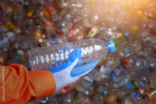 workers handing bottle in recycling factory,a worker who recycling thing on recycle center,