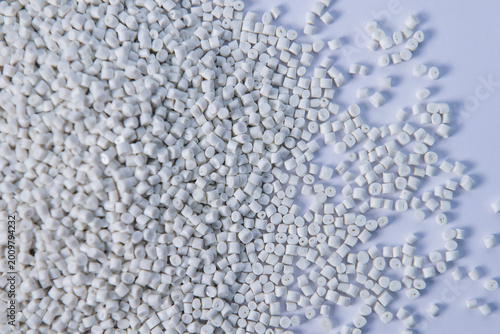 Polypropylene granule close-up background texture. plastic resin ( Masterbatch).Grey chemical granules for industrial plastic production
