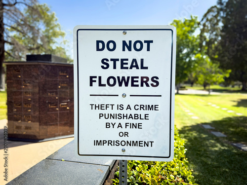 Tableau sur toile A sign at a cemetery stating Do Not Seal Flowers punishable by fines or jail