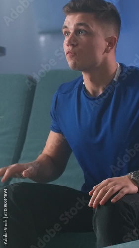 Person Of European Descent Wholeheartedly Immersed In Competitive Gaming Broadcasts On Television