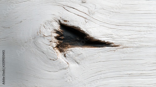 White painted weathered wood surface with visible knot and distressed texture, abstract grain background