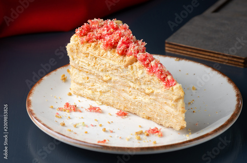 Napoleon cake, piece of crunchy pie on plate
