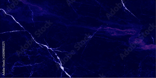 Photos A powerful blue lightning bolt strikes through the dark night sky during a dange
