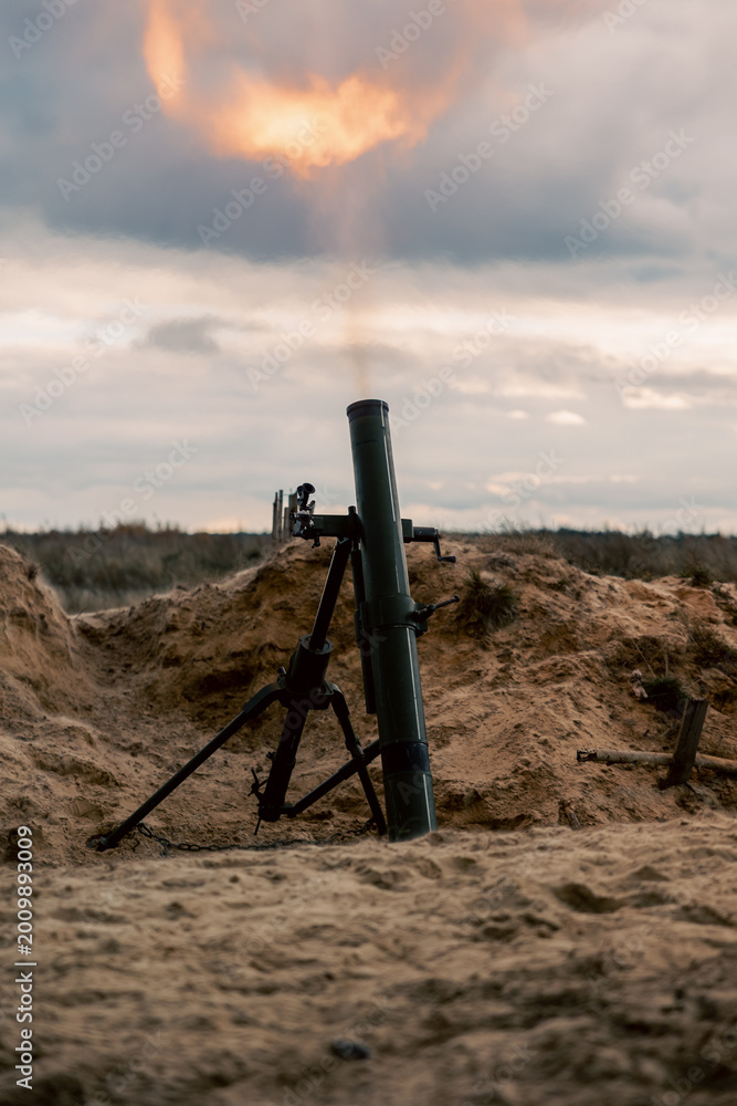 Fototapeta premium The moment of the mortar fire, on the river bank.