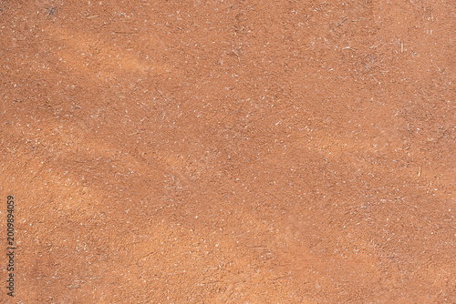 Foto Clay wall texture showing natural adobe material surface