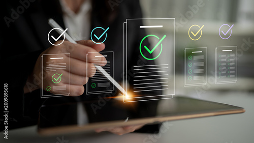 Schilderij op canvas A business professional uses a digital pen to review documents on a tablet, with checkmark symbols indicating approval in a modern office environment focused on efficiency and accuracy