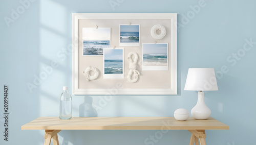 Wooden desk with a lamp and a gallery of ocean photos. Coastal interior.
