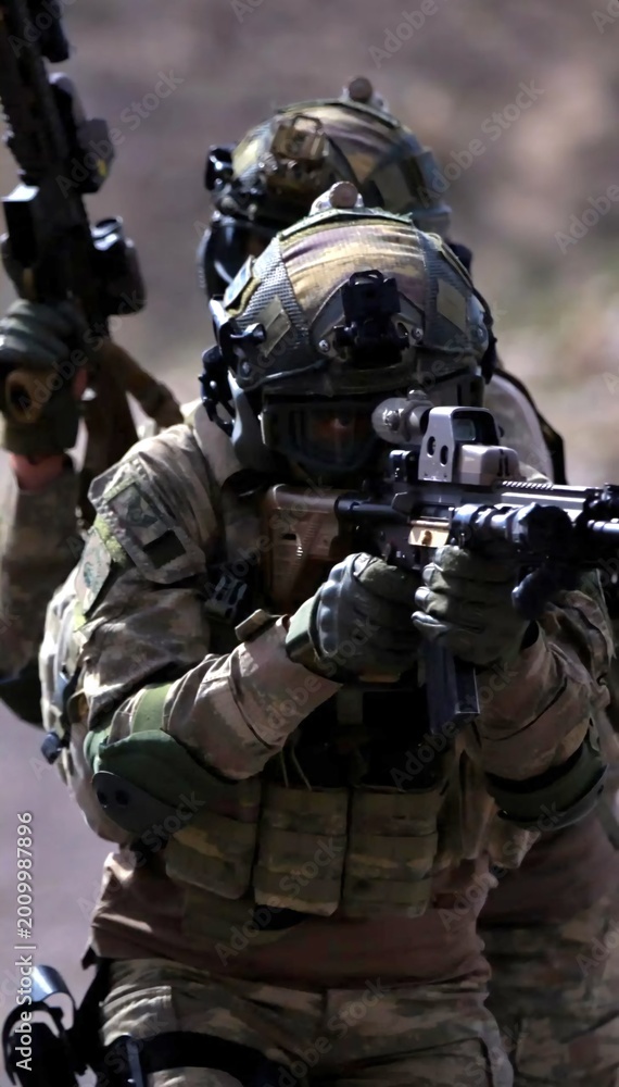 Fototapeta premium Military Personnel During Tactical Field Training and Combat Exercises 