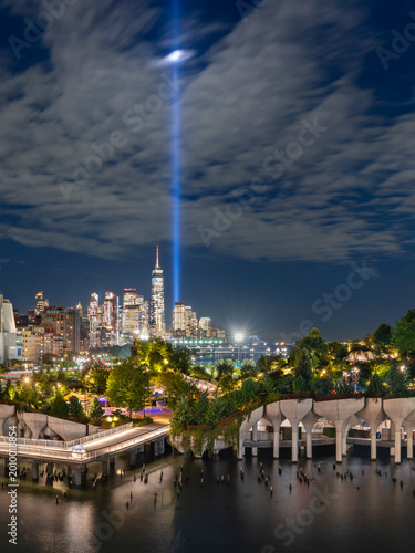 Photography Little Island at night with the Tribute in Light September 11 memorial spotlight