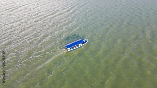 Boat travelling across lake.
Aerial drone view of  Lago Suchitlan in El Salvador. The Cerrón Grande Reservoir, also known locally as Lake Suchitlán