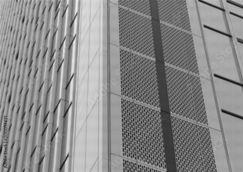 Close up of a modern building facade with repeating windows and textured panels. Monochrome urban architecture with strong geometric pattern and