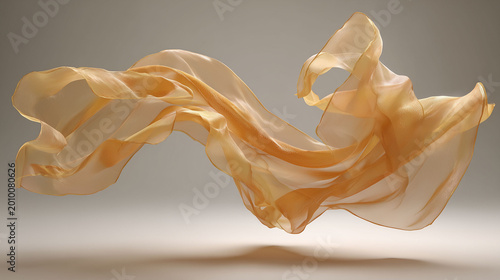 Elegant golden silk fabric flowing in the air on gray background