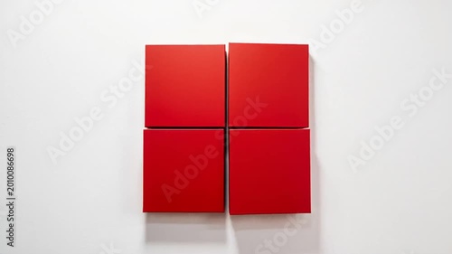 Abstract Red Geometric Shapes Assembling on White Wall