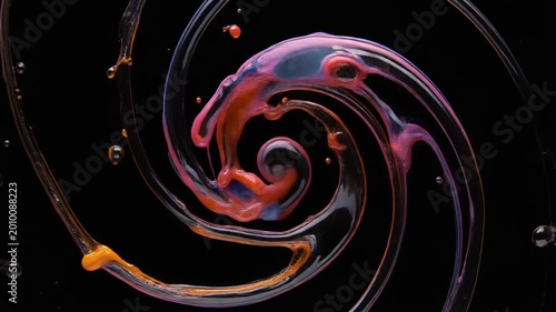 Abstract Swirling Liquid Droplets with Orange and Purple Hues on Black Background