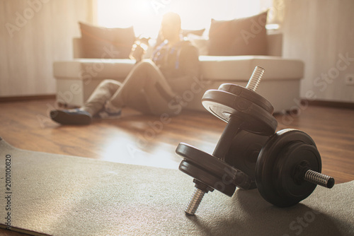 Photos Young ordinary man go in for sport at home