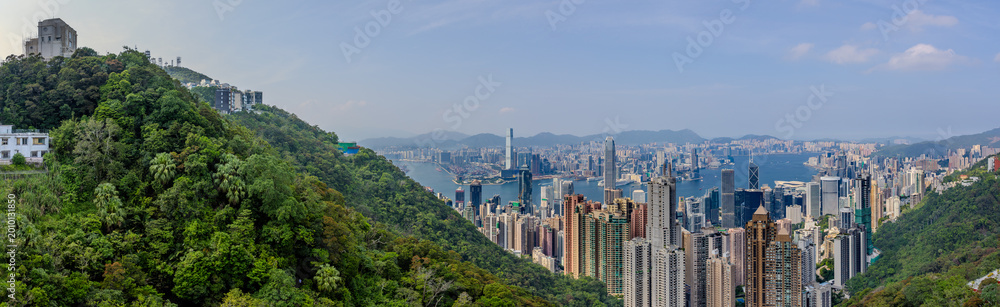 Fototapeta premium 20 April 2026 Down View of Residential and Commercial buildings and Victoria Harbour in Hong Kong HK in china. The Blue Skies and blue harbour is so Beautiful with view of Tsim Tsa Tsui commercial CBD