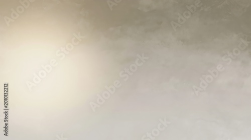 A bright light source shines on a textured beige wall, creating a soft gradient of light and shadow.